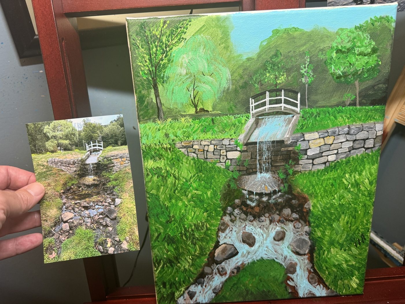 Bridge and waterfall painting