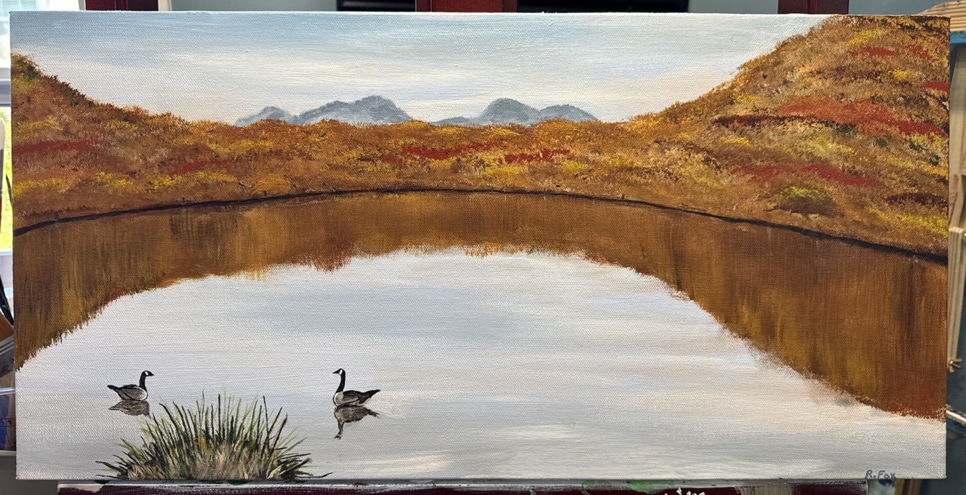 Autumn lake with two geese