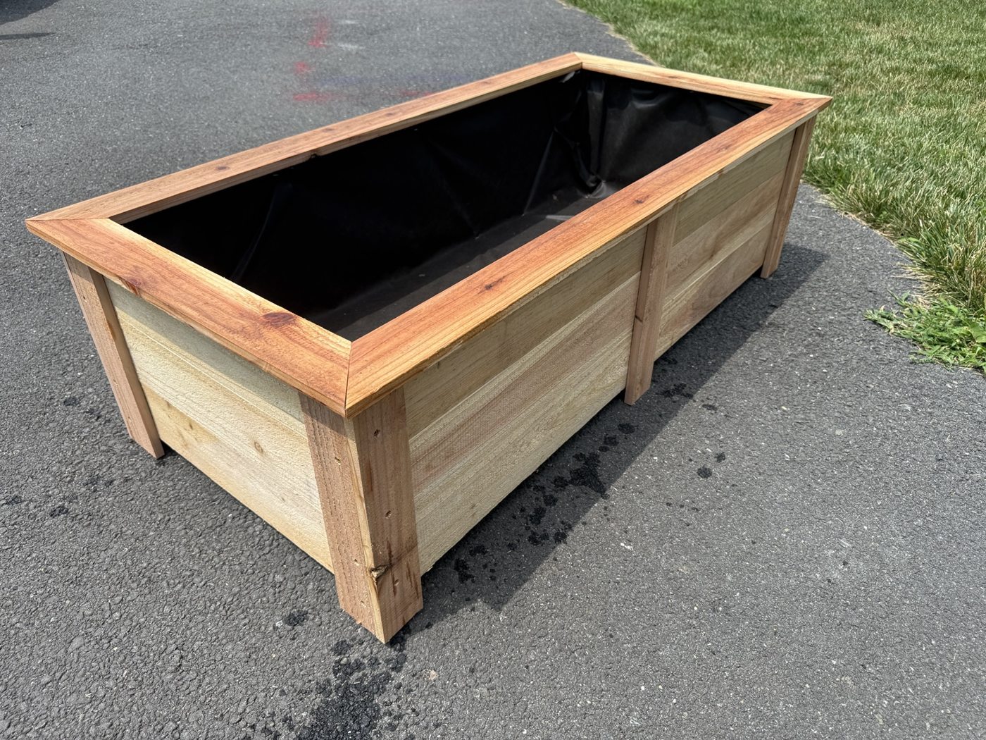 Cedar planter with mitered trim and liner